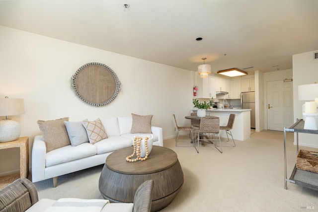 living room featuring light colored carpet