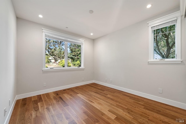 empty room featuring hardwood / wood-style flooring