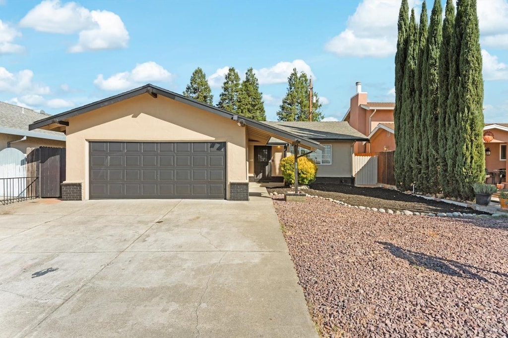 ranch-style house featuring a garage