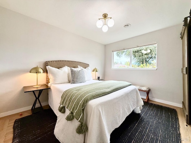 bedroom featuring hardwood / wood-style floors