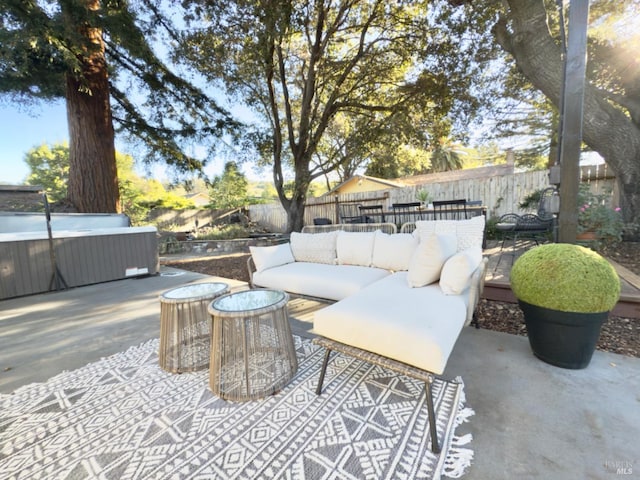 view of patio featuring an outdoor living space and a hot tub