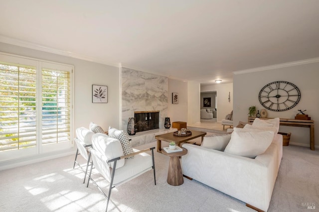 carpeted living room with a high end fireplace and ornamental molding