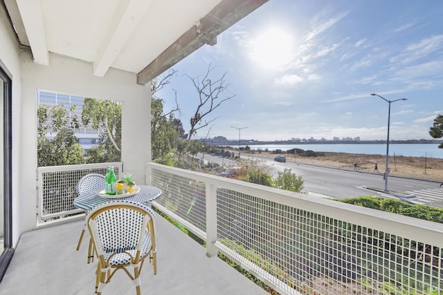 balcony featuring a water view