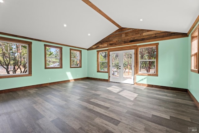 unfurnished living room featuring lofted ceiling, hardwood / wood-style floors, and french doors