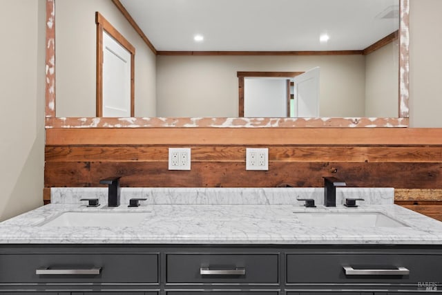 bathroom with vanity and crown molding