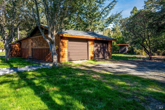 garage with a lawn