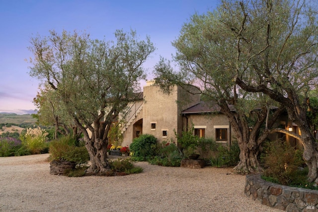 adobe home featuring stucco siding