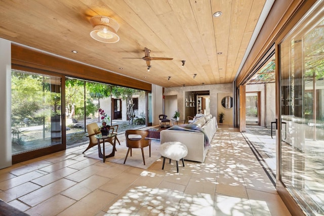 sunroom featuring wood ceiling