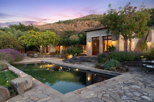 pool with a patio area