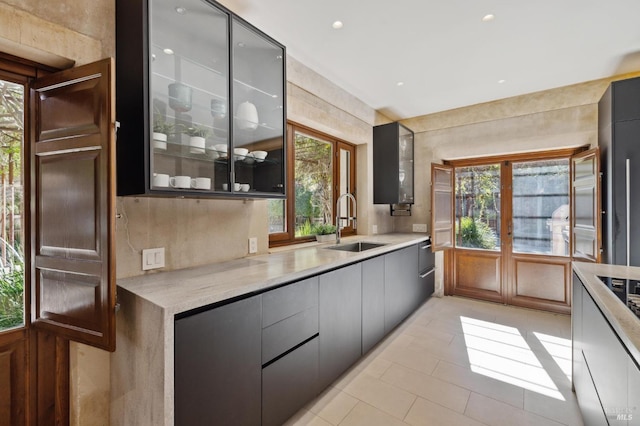 kitchen featuring a sink, modern cabinets, and light countertops