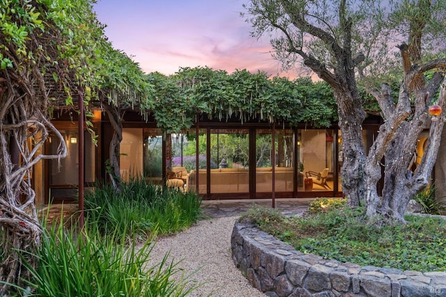 yard at dusk with a patio area