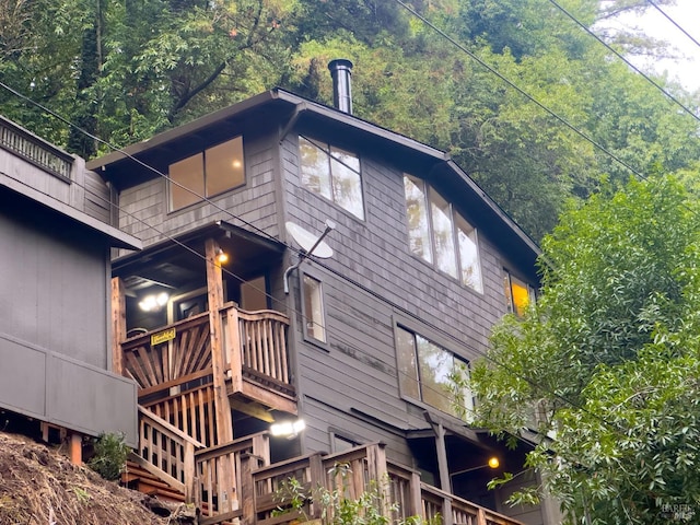 view of side of property with a balcony