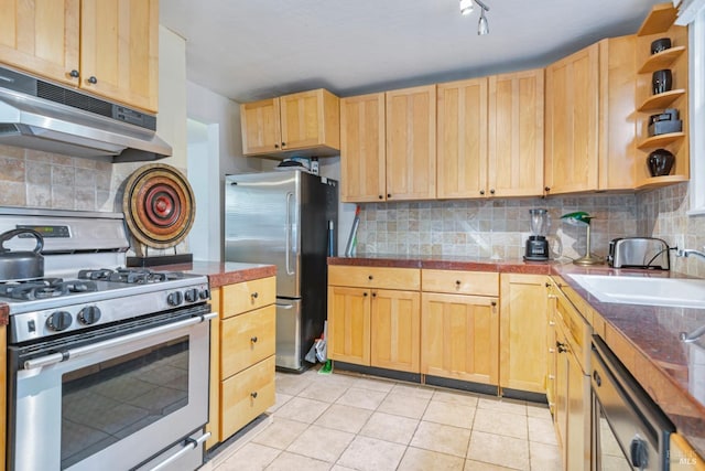 kitchen with backsplash, appliances with stainless steel finishes, light brown cabinets, under cabinet range hood, and light tile patterned floors