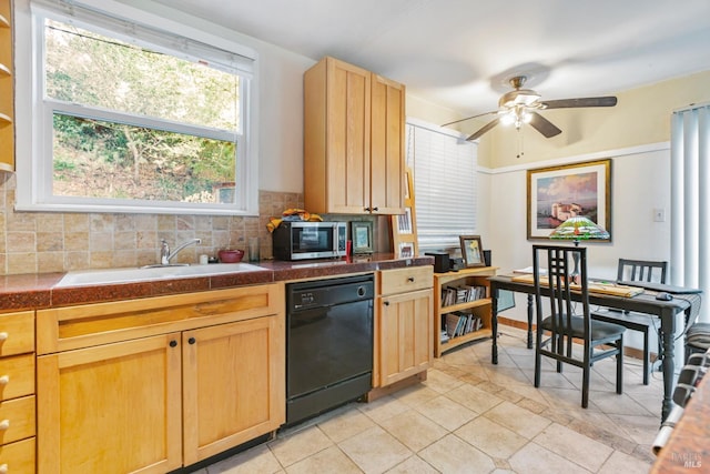 kitchen with a sink, tile countertops, light brown cabinetry, stainless steel microwave, and black dishwasher