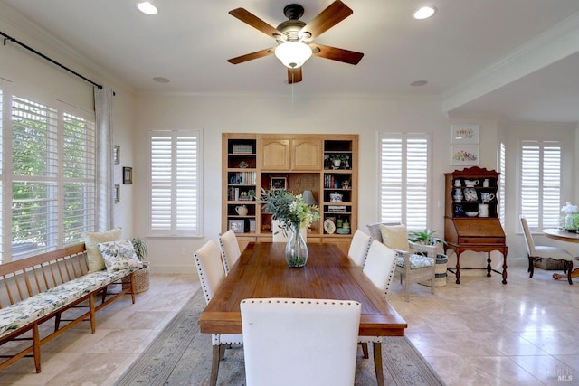 dining area featuring crown molding, built in shelves, and ceiling fan