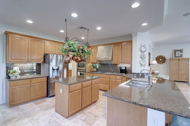 kitchen featuring a kitchen island, wall chimney exhaust hood, kitchen peninsula, stainless steel appliances, and sink