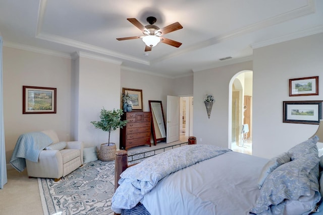 bedroom with crown molding, light colored carpet, and ceiling fan