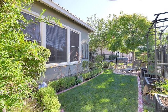 view of yard with a patio and fence