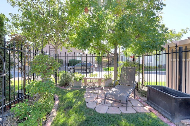 view of yard featuring a patio area and fence