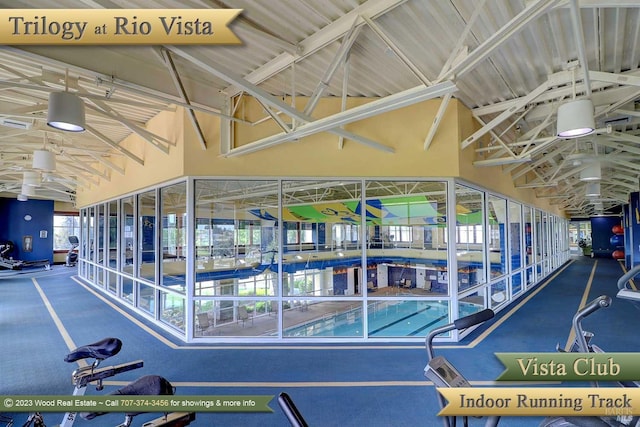 exercise room featuring vaulted ceiling