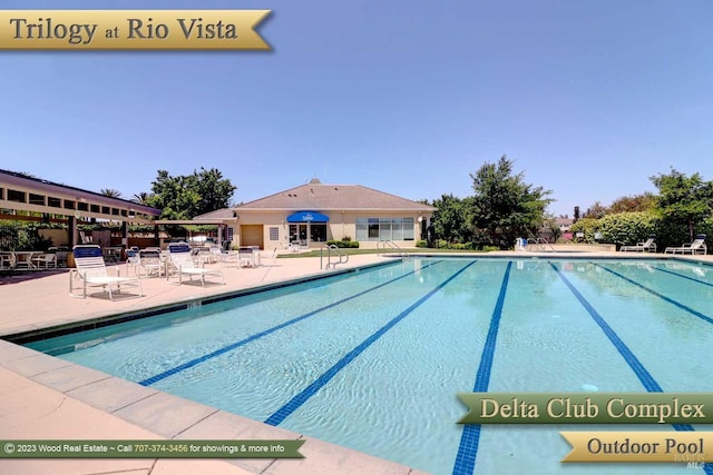 community pool with a patio area