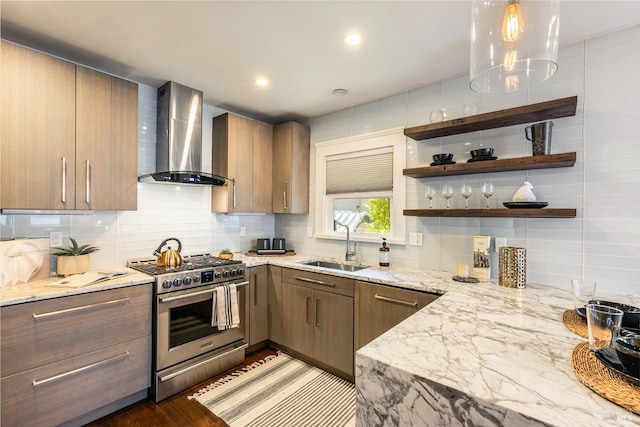 kitchen with sink, wall chimney exhaust hood, stainless steel stove, dark hardwood / wood-style floors, and decorative backsplash