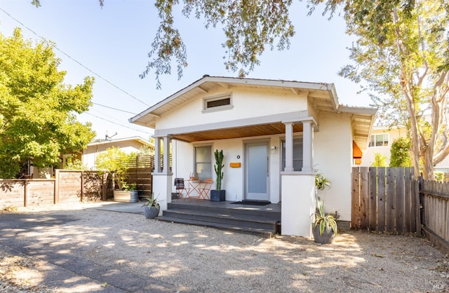 bungalow-style home featuring covered porch