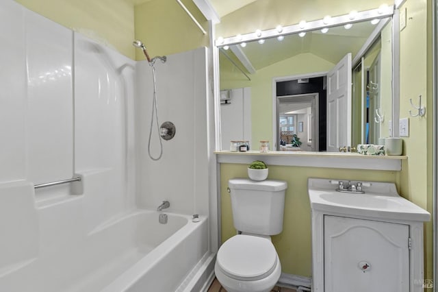 full bathroom featuring vanity, shower / bathing tub combination, lofted ceiling, and toilet