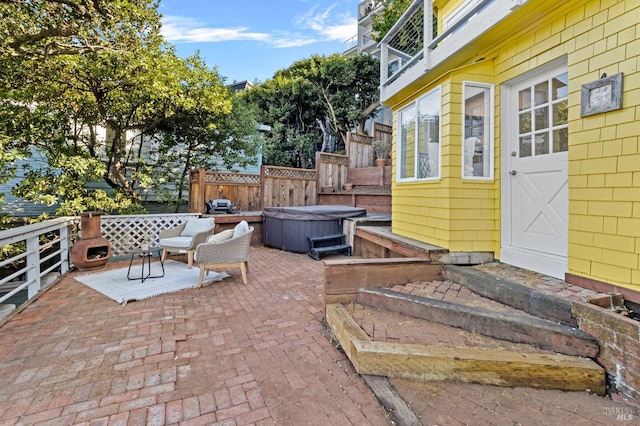 view of patio / terrace featuring a hot tub