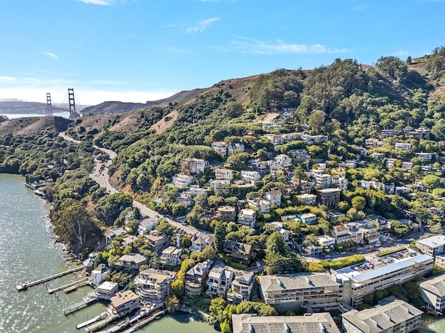 birds eye view of property featuring a water and mountain view