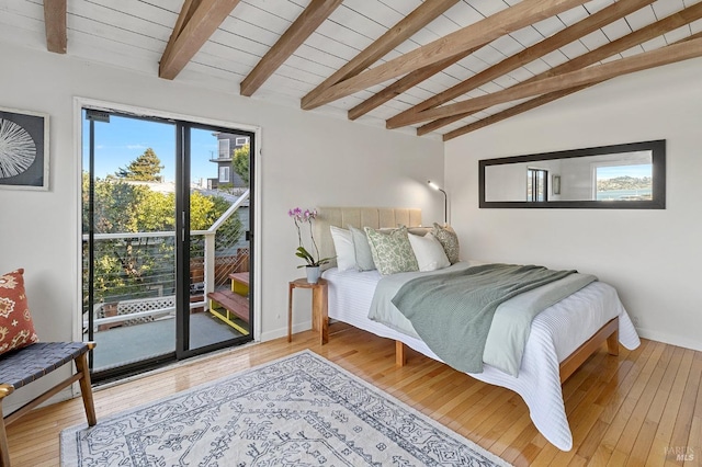 bedroom with hardwood / wood-style flooring, wooden ceiling, access to outside, and vaulted ceiling with beams