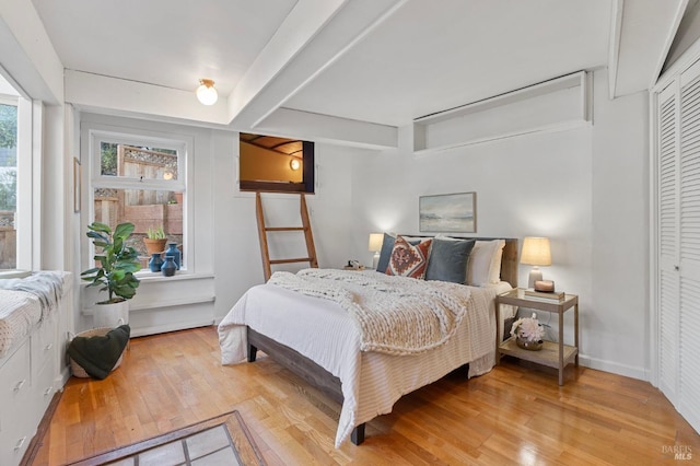 bedroom with light hardwood / wood-style floors