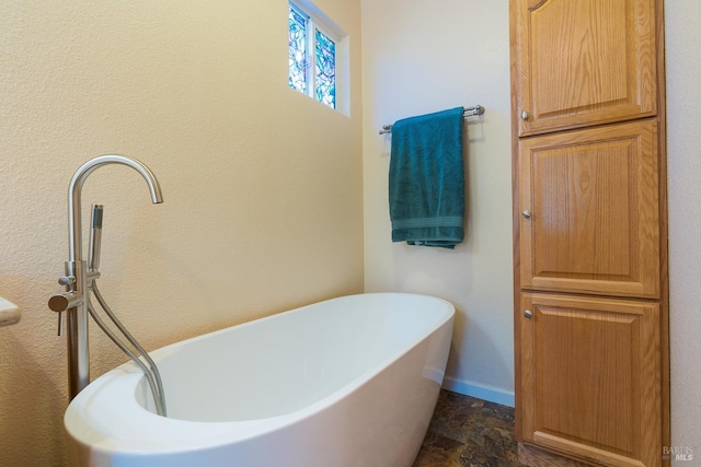 bathroom with a tub