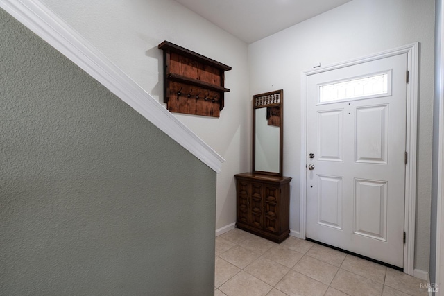 entrance foyer featuring light tile patterned flooring