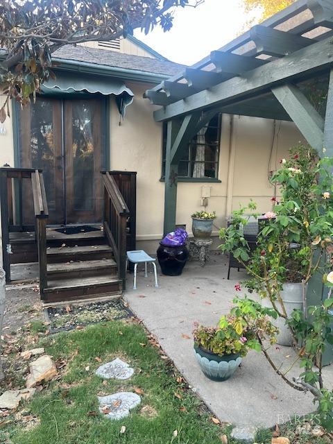 rear view of property featuring a patio area