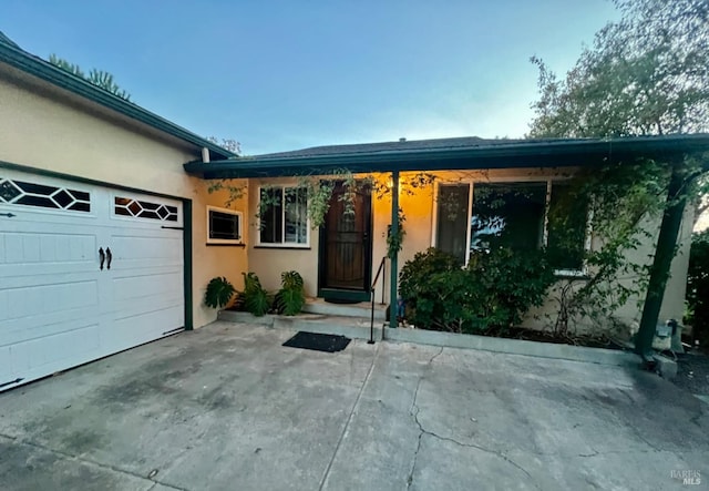 ranch-style house featuring a garage