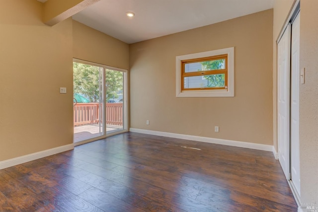 unfurnished room featuring dark hardwood / wood-style flooring