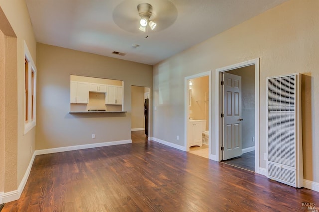 unfurnished living room with ceiling fan and dark hardwood / wood-style floors