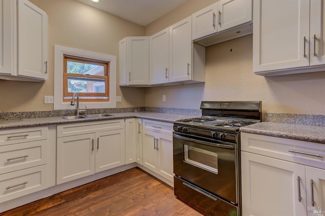 104 Alabama St, Vallejo, CA 94590 - kitchen with black gas stove, a sink, white cabinetry, and dark wood-type flooring