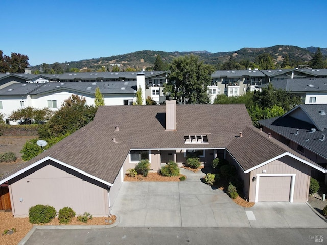 drone / aerial view with a mountain view and a residential view