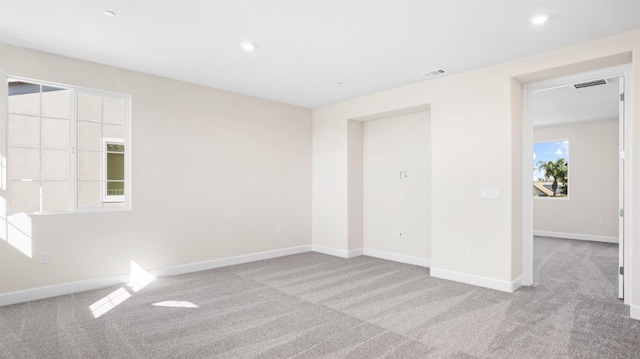 interior space with recessed lighting, carpet flooring, baseboards, and visible vents