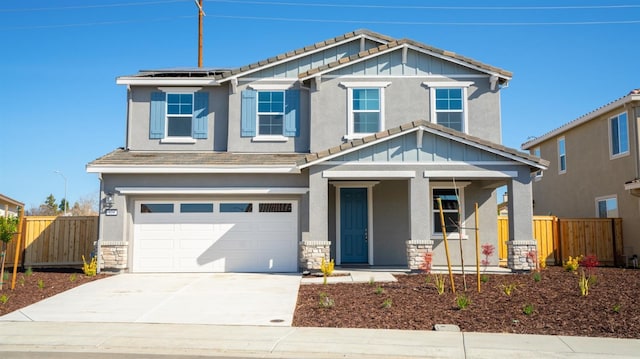 craftsman house featuring roof mounted solar panels, a tiled roof, and fence