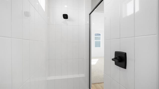 full bathroom with tiled shower