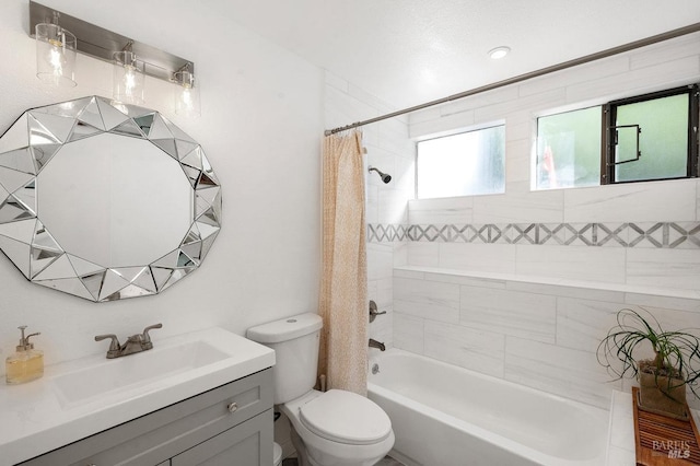 full bathroom featuring vanity, toilet, and shower / bathtub combination with curtain