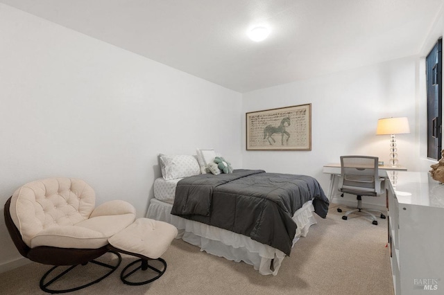 bedroom with light carpet