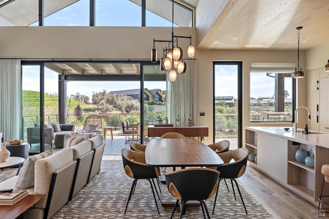 dining space with an inviting chandelier and wood finished floors