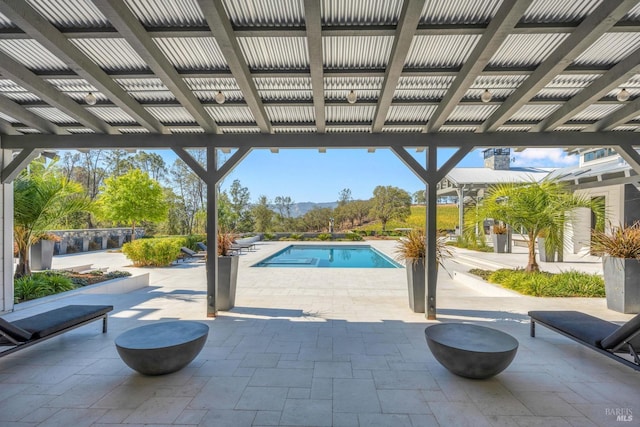 view of swimming pool featuring a patio area and a pergola