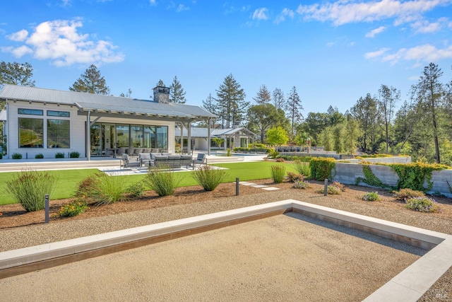 view of yard featuring an outdoor hangout area, a patio area, and ceiling fan