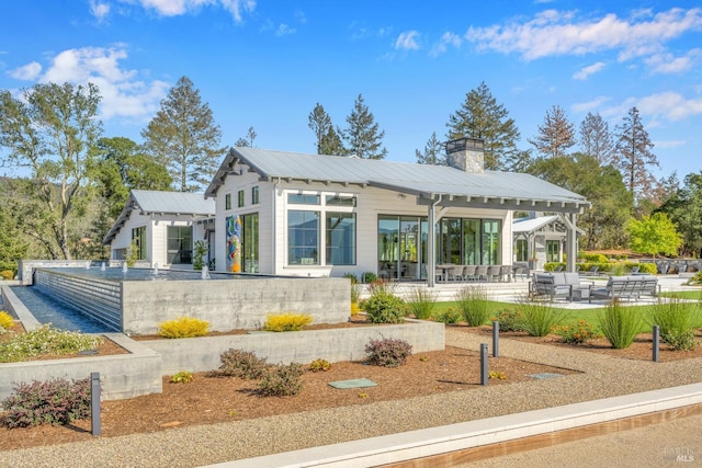 back of house featuring a patio area