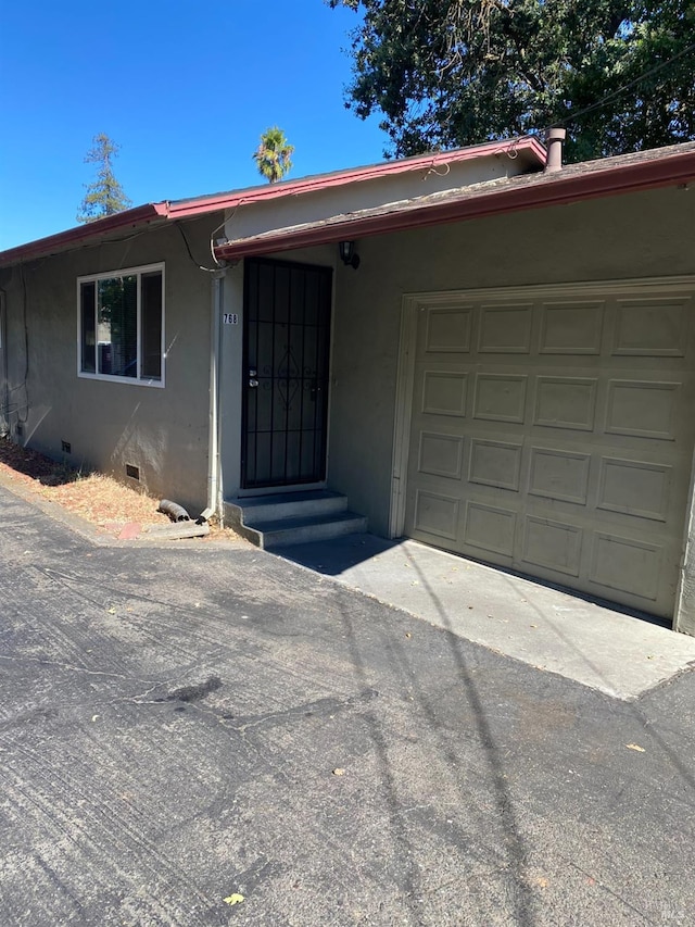 single story home with a garage